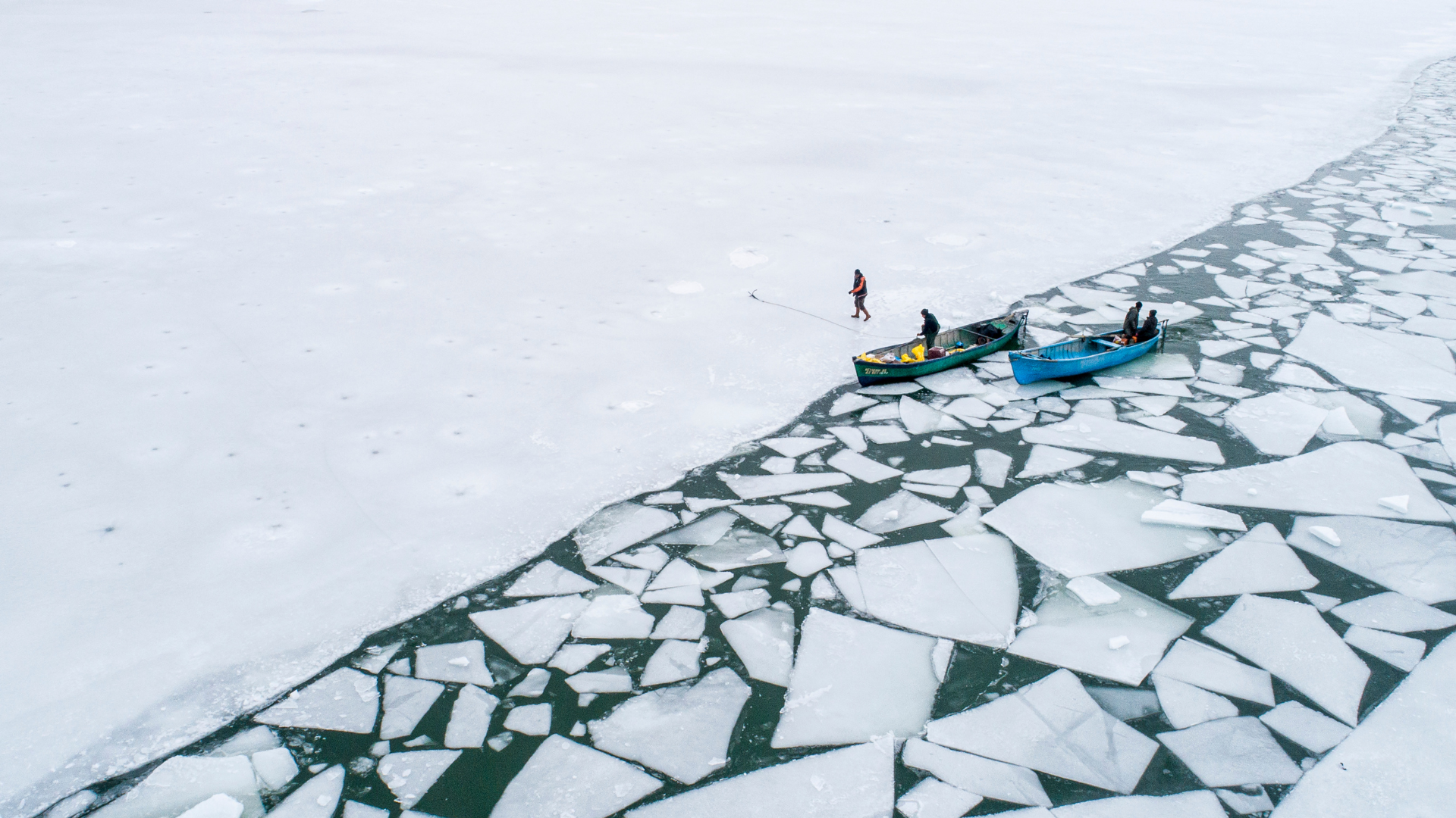 Boats at the edge of breaking ice